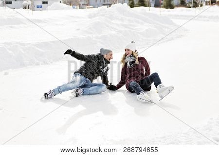 Couple In Sunny Winter Nature Ice Skating