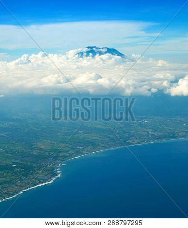 Aerial View From Aiprlane On Bali Seashore And Agung Volcano. Indonesia