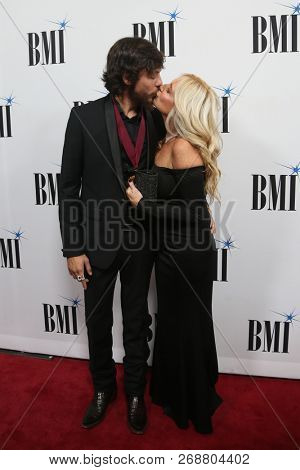 NASHVILLE, TN - NOV 13: Chris Janson (L) and wife Kelly Lynn attends the BMI Country Awards 2018 at BMI Nashville on November 13, 2018 in Nashville, Tennessee.