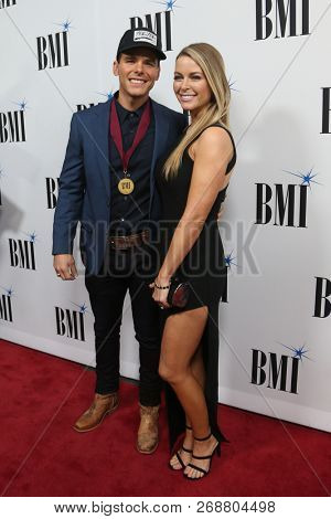 NASHVILLE, TN - NOV 13: Granger Smith (L) and wife Amber attend the BMI Country Awards 2018 at BMI Nashville on November 13, 2018 in Nashville, Tennessee.