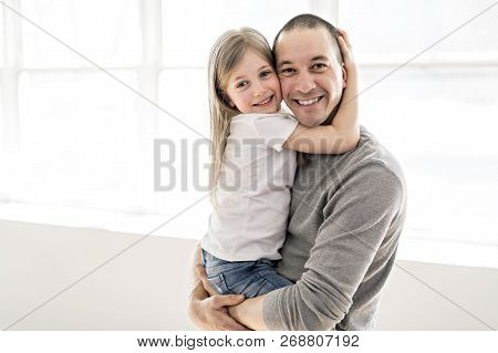 Handsome Young Father And His Cute Little Daughter