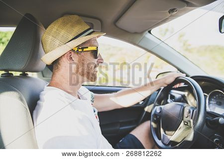 Men Sitting In A Rental Car On Holiday Vacancy With Sunglasses
