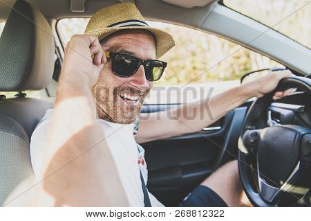 Men Sitting In A Rental Car On Holiday Vacancy With Sunglasses