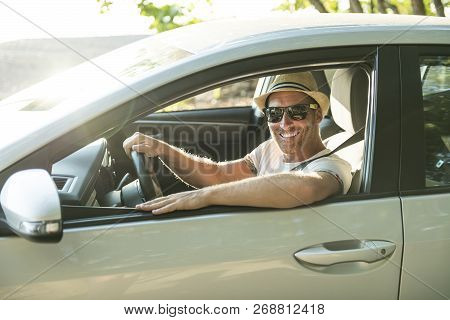 Men Sitting In A Rental Car On Holiday Vacancy