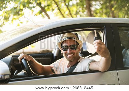 Men Sitting In A Rental Car On Holiday Vacancy
