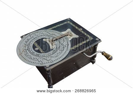 Old-time Music Box In A Black Wooden Box With A Punching Disk.