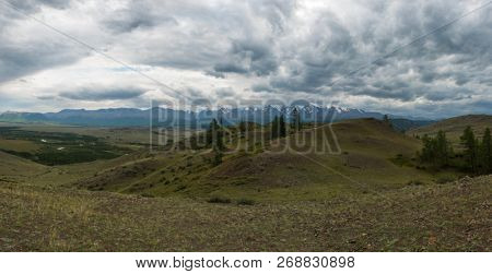 Summer in Kurai steppe and North-Chui ridge of Altai mountains, Russia. Cloud day.