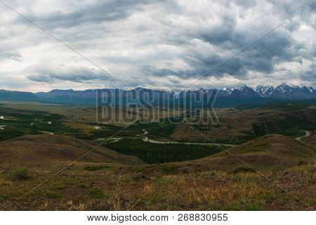 Summer in Kurai steppe and North-Chui ridge of Altai mountains, Russia. Cloud day.