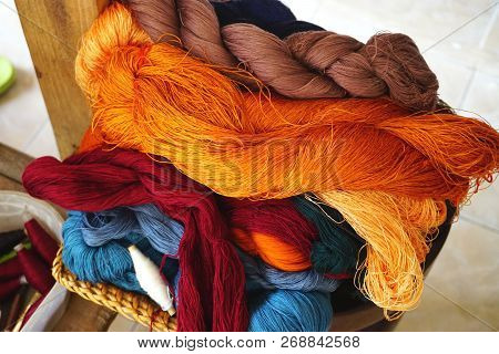 Skeins Of Colorful Silk Thread For Weaving, Embroidery And Needlework At A Market In Southeast Asia