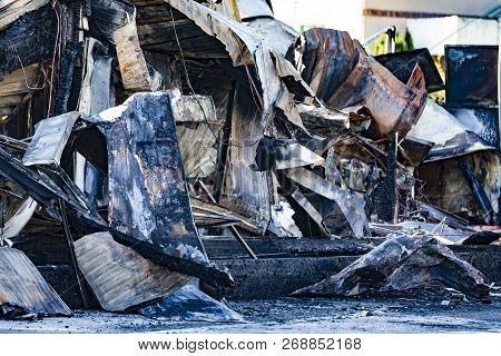 Damaged Industry Supermarket After Arson Fire With Burn Debris Of Twisted Metallic Wood Structure Af