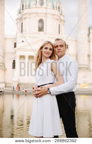 Happy Couple Walking In The Austria, Viena. They Love Each Other And Spent Time Together