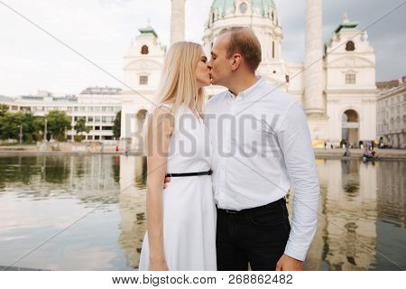 Happy Couple Walking In The Austria, Viena. They Love Each Other And Spent Time Together