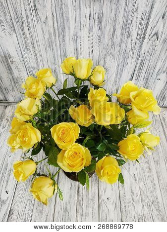 Bouquet Of Yellow Roses Close-up On Wooden Vintage Background