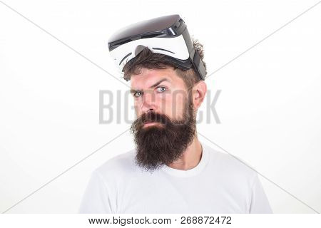 Happy Bearded Man Wearing Virtual Reality Goggles Watching Movies Or Playing Video Games. The Man Wi