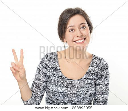 Smiling Young Woman Showing Victory Or Peace