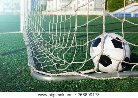 Football On A Green Field . Sport. The Ball In The Goal.