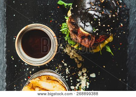 Delicious Black Beef Burger With Soia Sos And French Fries