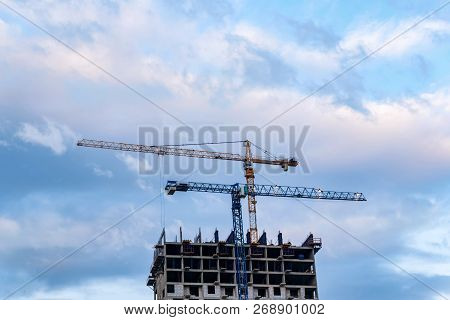 Modern Construction Site Of Building With Crane