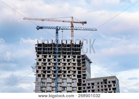 Modern Construction Site Of Building With Crane