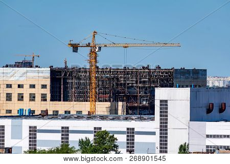 Modern Construction Site Of Building With Crane
