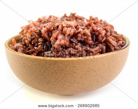 Rown Rice, Riceberry Organic Food ,healthy Food Eating Concept , Isolated On White Background.