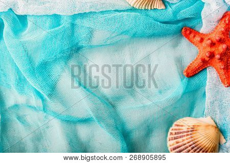 Seashells And Starfish On Cian Cloth Background