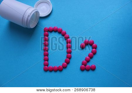Pink Round Pills Lined With The Letter D2