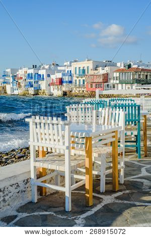 Chairs With Tables In Greek Tavern In Little Venice Part Of Mykonos Town, Mykonos, Greece