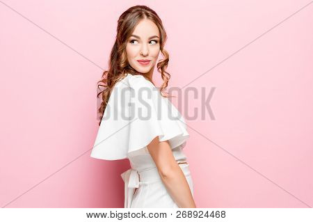 Happy Business Woman Standing And Smiling Isolated On Pink Studio Background. Beautiful Female Half-