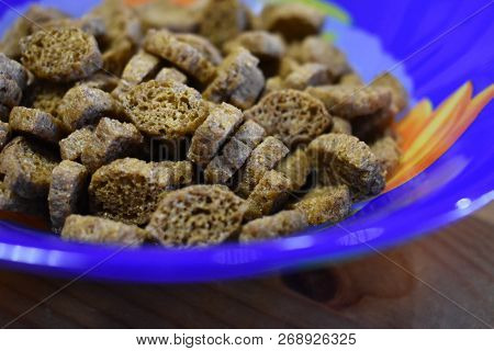 Many Pieces Of Dry Bread With Spices In A Blue Plate, A Beer Snack.