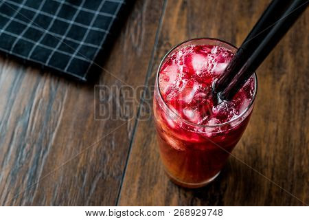 Alabama Slammer Cocktail With Black Straw.