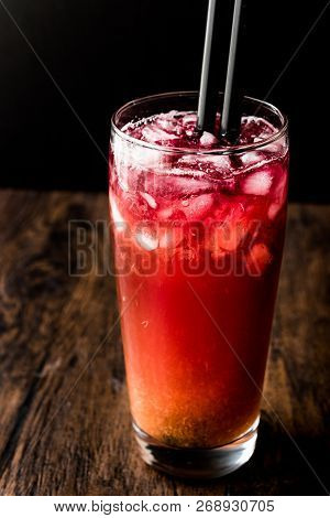 Alabama Slammer Cocktail With Black Straw.