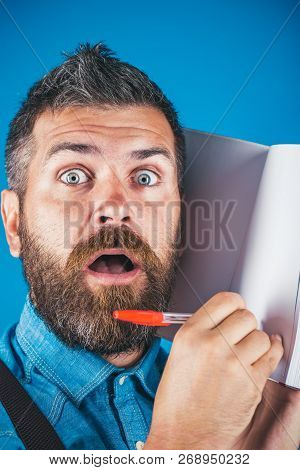 Bearded Brutal Man. Mature Hipster With Beard. Surprised Man Making Notes In Notebook. Male With Bea