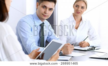 Group Of Business People Or Lawyers Discussing  Terms Of Transaction In Office. Colleagues Working A
