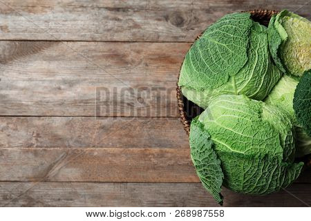 Bowl With Savoy Cabbage And Space For Text On Wooden Background, Top View