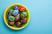 painted Easter eggs on yellow plate