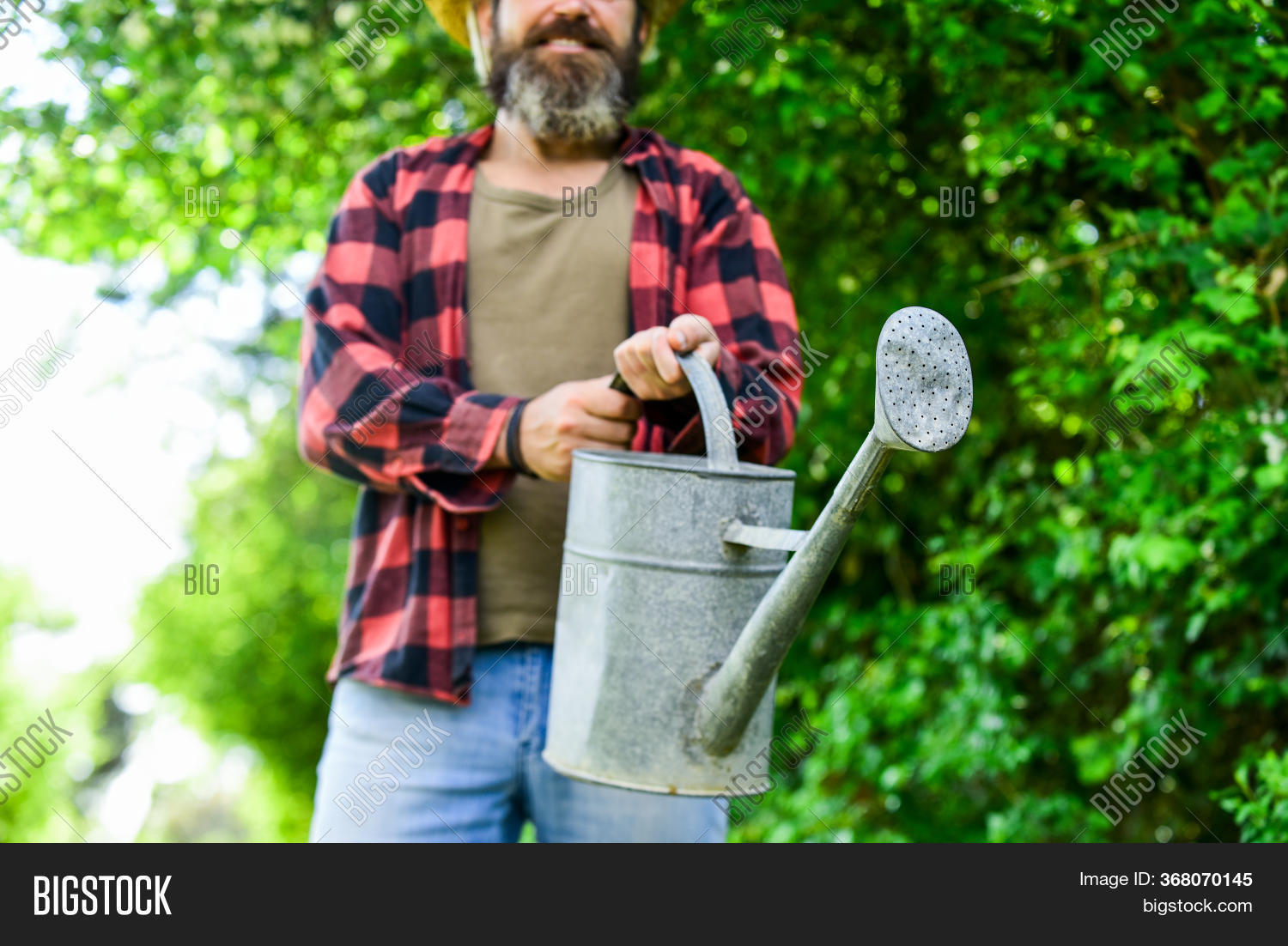 Man Using Big Watering Image & Photo (Free Trial) Bigstock