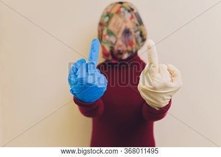 Woman Showing Middle Finger Handgesture. Get Out Covid-19 Or Stop Coronavirus Concepts. Time To Stay