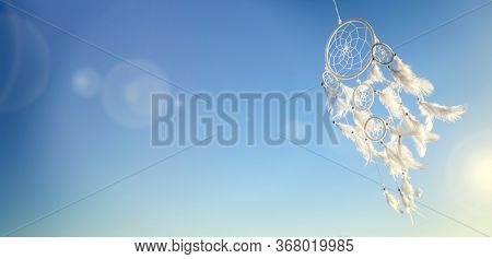 Dream catcher on blue sky sunset background with copy space