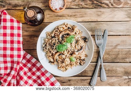Homemade Traditional Italian Mushroom Risotto On Rustic Wooden Background. Classic Risotto With Mush