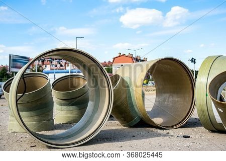 Pipes Of Large Diameter. Stacked Pipes In Construction Site ,transition Of A Pipe, Dismantling