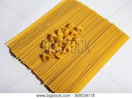 Composition Of Undigested Macaroni Pasta Made With Hard Light On A White Background.