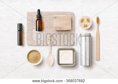 zero waste / zero plastic bathroom or spa: conceptual flatlay with natural and hand made beauty and skincare products made of natural materials and ingredients e.g. bamboo, loofah and essential oils