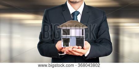 House Residential Structure In Hand.  Concept Of Investment Propert And Finance Investment Concep