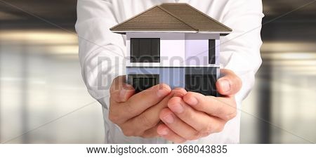 House Residential Structure In Hand.  Concept Of Investment Propert And Finance Investment Concep