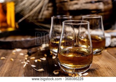Speyside Scotch Whisky Tasting On Old Dark Wooden Vintage Table With Barley Grains Close Up