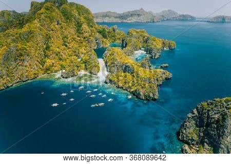 Palawan, Philippines Aerial View Of Tropical Miniloc Island. Tourism Trip Boats At Big Lagoon Entran