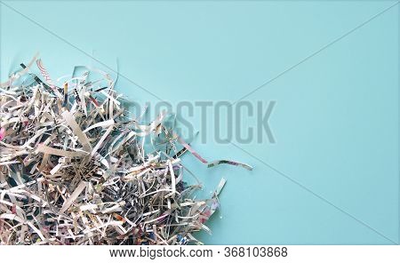 Shredded Paper On Light Blue Background. Selective Focus Image.