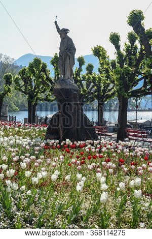 Public Garden With A Statue Of Willhelm Tell On The Lakefront At Lugano On Switzerland