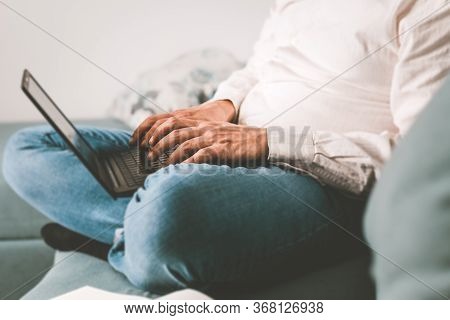 Man working on laptop from home. Busy people lifestyle. Man typing on laptop computer. Work from home lifestyle in covid-19. Covid-19 quarantine lifestyle. Man typing message on laptop computer. Technology lifestyle. Using laptop computer. Laptop computer